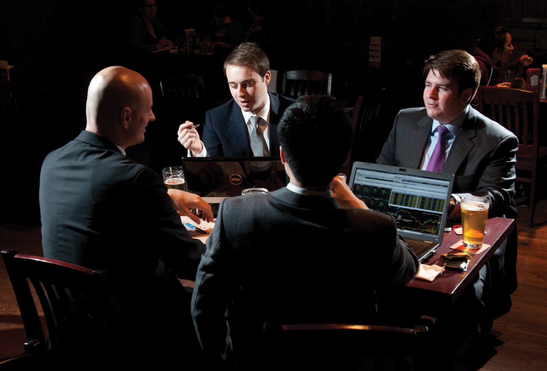 MBA’12s Peter Szaflarski, back left, Joe Sauret, Brendt Lambert and David Yao, back right, helped start the fund and secure Queen’s investment.